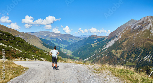 Hiking Woman looking at Alps / Region of Tux and Hintertux in Austria
