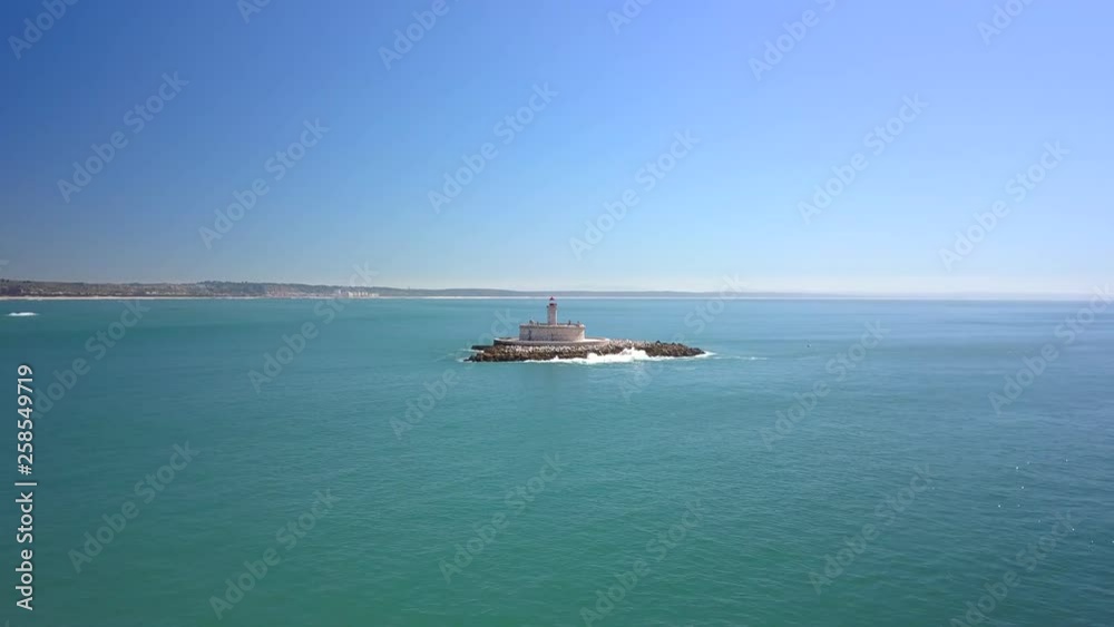 Aerial, drone shot, towards Bugio lighthouse, on the atlantic ocean, on a sunny day, near Oeiras coast and Tejo river, in Lisbon, Portugal Aerial, drone shot, towards Bugio lighthouse, on the atlantic ocean, on a sunny day, near Oeiras coast and Tejo river, in Lisbon, Portugal