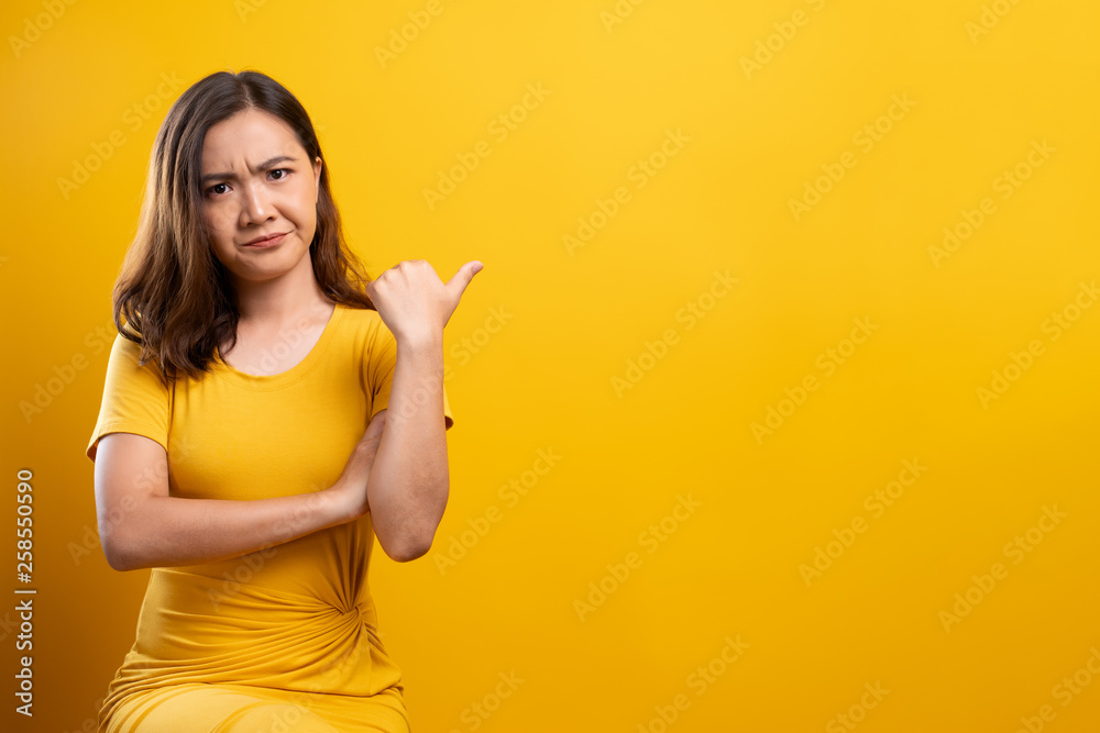 Angry woman isolated over yellow background Angry woman isolated over yellow background