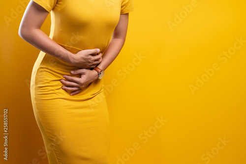 Woman suffers from stomach ache Close up