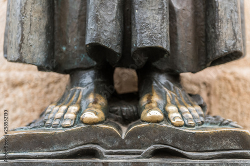 Detail of the bare feet of the sculpture of San Pedro de Alcantara in the cathedral of Santa Maria in the old town of Caceres. photo