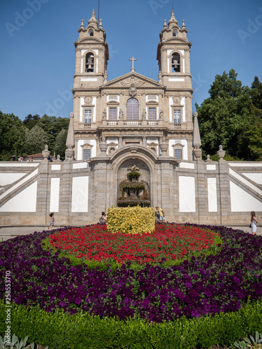 Old temple behind a garden of flowers