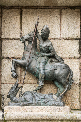 Detail of the sculpture of St. George killing the dragon in the Plaza de San Jorge in the old town of Caceres.