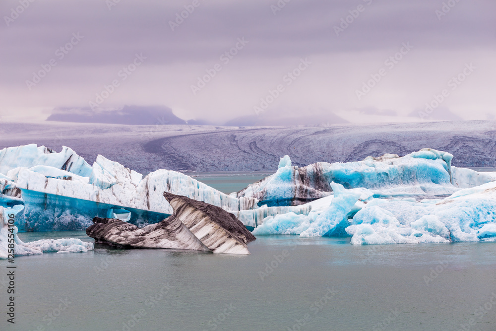 A view of Jokulsalron Glacier in southern Iceland and ice falling to the ocean, Iceland