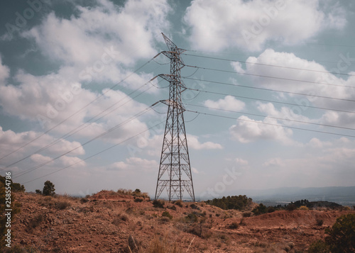 electric tower in a landscape with blue sky