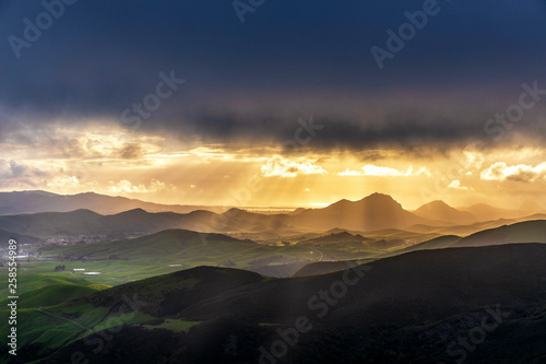 Sunset in the Mountains with Sunbeams 