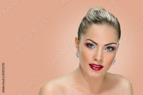 Sexy woman with red lips on background sepia shade yellow