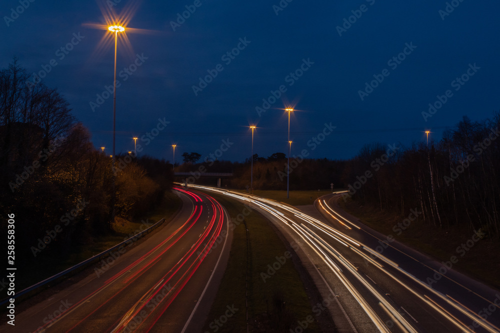 Motorway with Ramp at Dusk with Car Lights