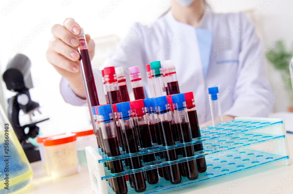 Young female chemist working in the lab Young female chemist working in the lab