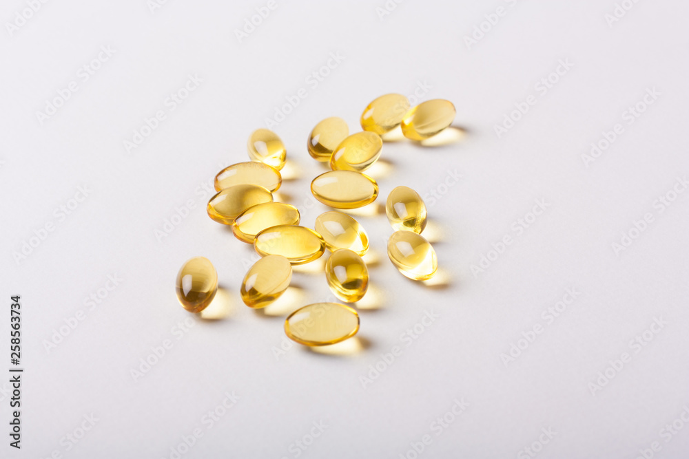 Fish oil capsules (omega 3) on a white background Fish oil capsules (omega 3) on a white background