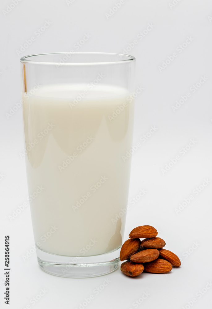 glass of almond milk on white background glass of almond milk on white background