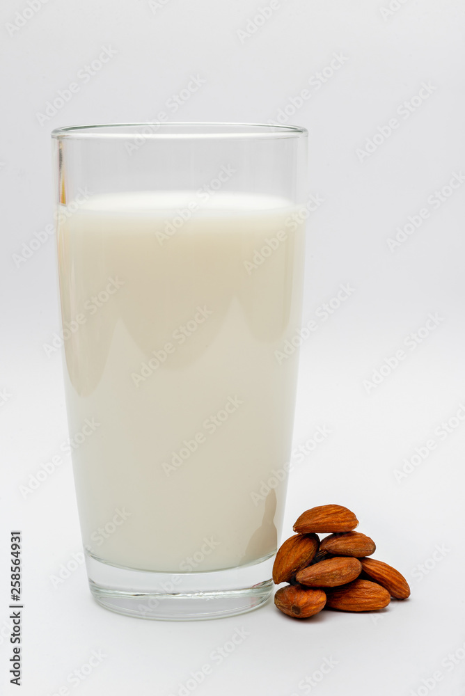 glass of almond milk on white background glass of almond milk on white background