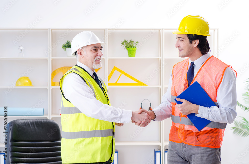 Two engineers colleagues working under project Two engineers colleagues working under project