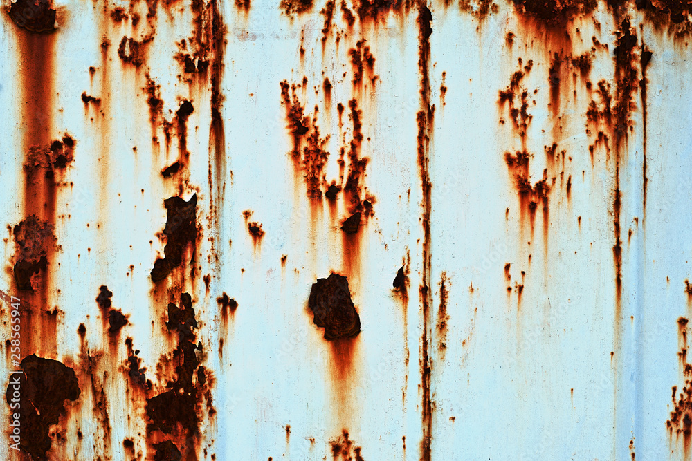 Fototapeta premium Very red corrosion on a blue background