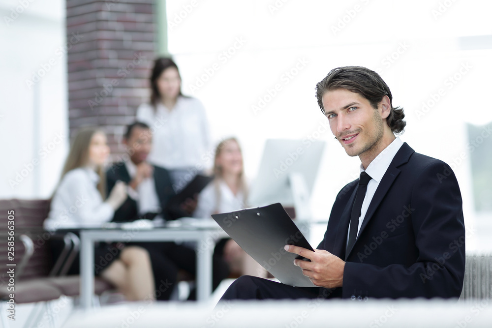 confident businessman studying the document in his office confident businessman studying the document in his office