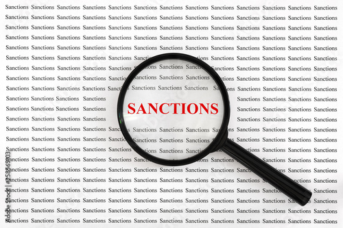 Word "sanctions" of red letters under loupe. Concept of increasing, expanding or considering sanctions. Text on paper is viewed under magnifying glass.