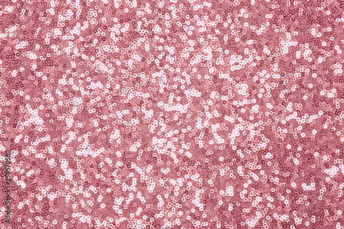 Sparkling pink, rose sequin textile background. Fashion fabric glitter, sequins photo