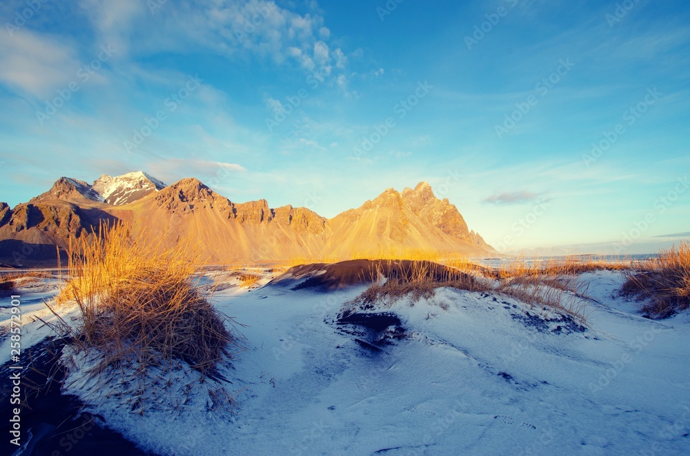 Mountains behind sand dunes in winter