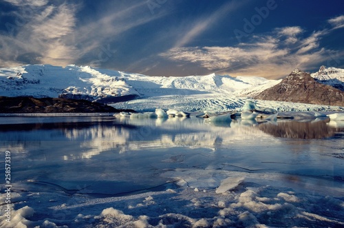 Winter's day with ice, snow, glacier, sky, and stillness © JMP Traveler