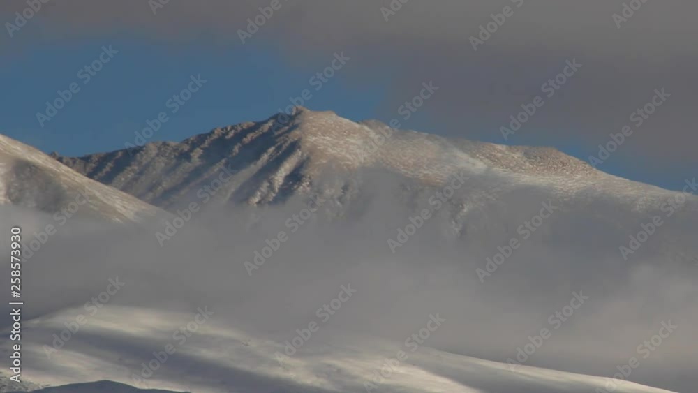 Beautiful view of clouds slowly moving across the snow capped mountains in Nepal Mustang Chhosar Beautiful view of clouds slowly moving across the snow capped mountains in Nepal Mustang Chhosar