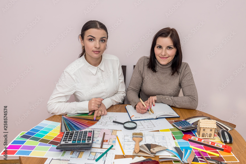 Teamwork of creative designers working with colour palette Teamwork of creative designers working with colour palette