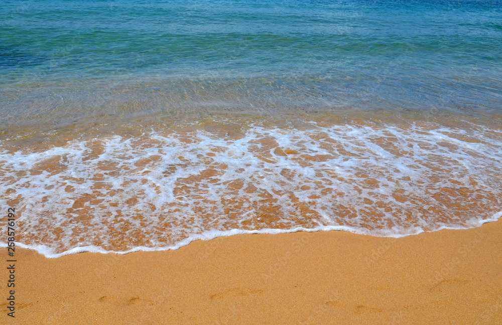 Summer background with turquoise ocean water and golden sand on tropical beach. Sea waves.Vacation,relax or travel concept with copy space. Summer background with turquoise ocean water and golden sand on tropical beach. Sea waves.Vacation,relax or travel concept with copy space.