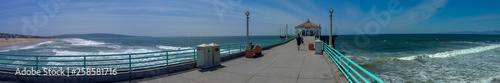 View of Southern California beach from pier on sunny day panorama © Glenn Highcove