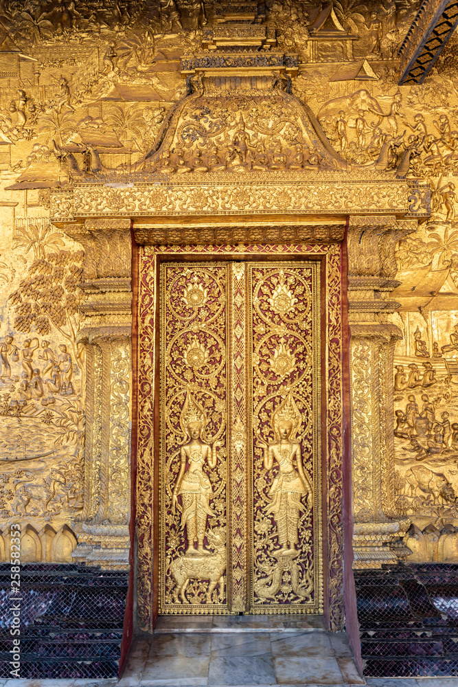 Bas-relief detail at the Xieng Wat Thong tempe in Luang Prabang, Laos.