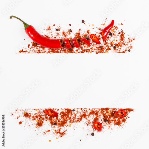 Raw fresh organic, red pepper flakes and dried ground chili pepper with sliced