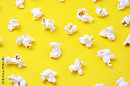 Single popcorn on a monochrome background - concept with fresh made popcorn on a monochrome background