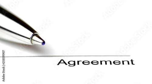 Close-up of a line for signing a contract on white paper with a pen - surface to place the signature to seal a contract in close-up
