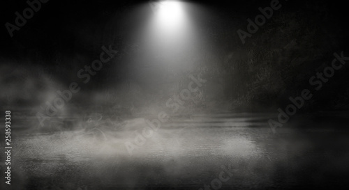 Background of an empty dark room, smoke and dust.