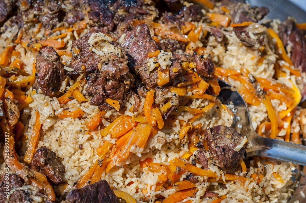 Rice pilaf, also known as plov or pilau, a national cuisine dish in Uzbekistan and other Central and South Asian countries, as well as in the Caucasus and other regions. 