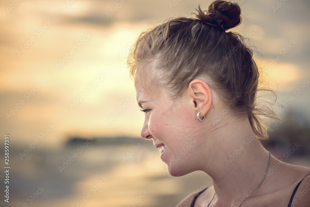 Portrait of pretty girl on the background of sunset Portrait of pretty girl on the background of sunset