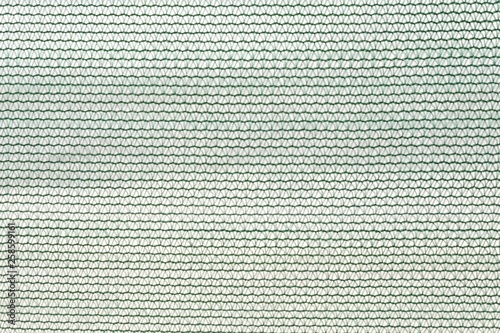 Close up green nylon net with a knot pattern for background backdrop