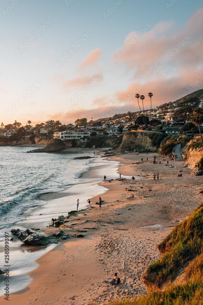 View of beach and cliffs at sunset, in Laguna Beach, Orange County, California