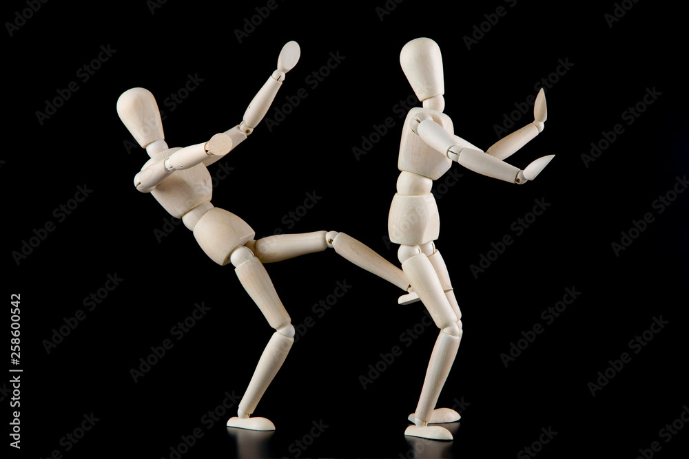 Mannequin dolls in interaction isolated on black background Mannequin dolls in interaction isolated on black background