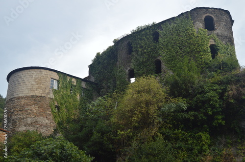 Phantasmagoric Abandoned Building Of Medieval Style Next To The River Suarna In Navia De Suarna. Nature, Architecture, History, Street Photography. August 23, 2014. Navia De Suarna, Lugo, Spain. photo