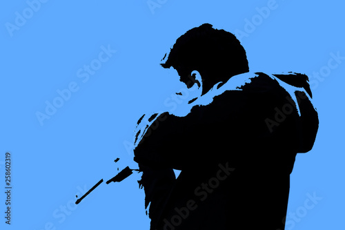 A man with a gun in his hands on a purple background. Man holding a gun. Blurred silhouette of a man. Military policy concept. Settlement of the military conflict.