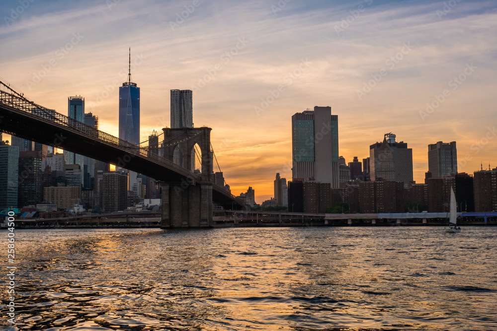 View of the Brooklyn bridge during a dusk from East river. New York City