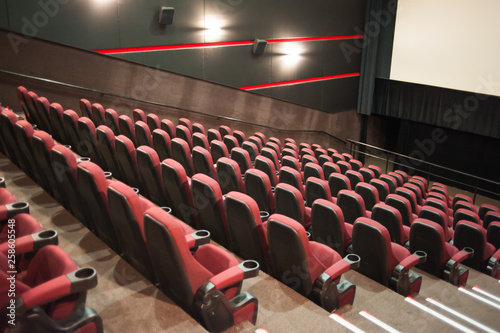 part of a theatre, or similar building, where the people who are watching and listening sit