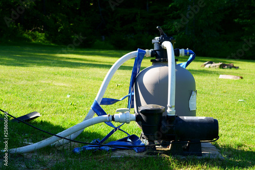 Obraz na plátne Automatic electric filter engine for swimming pool in the backyard