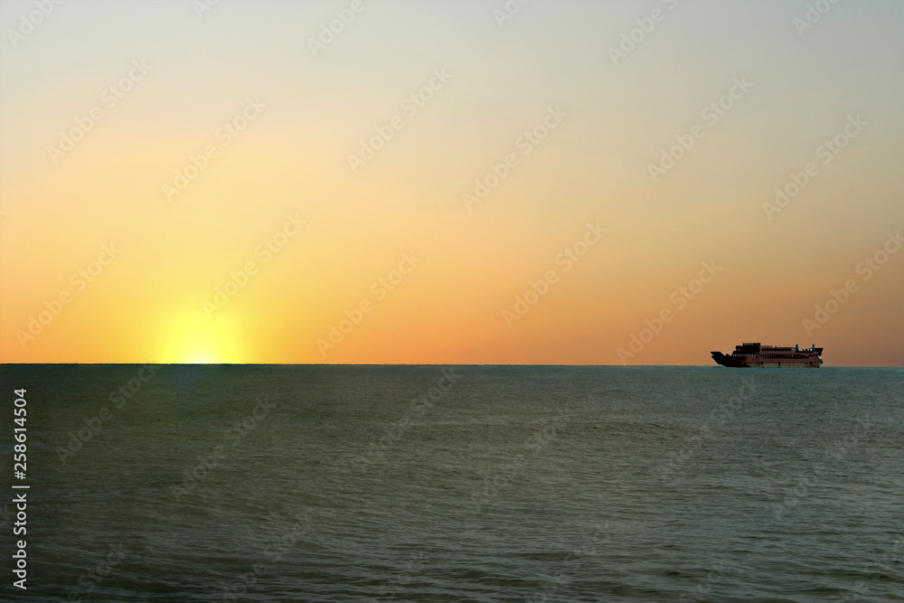 a beautiful sunrise appears on the high seas