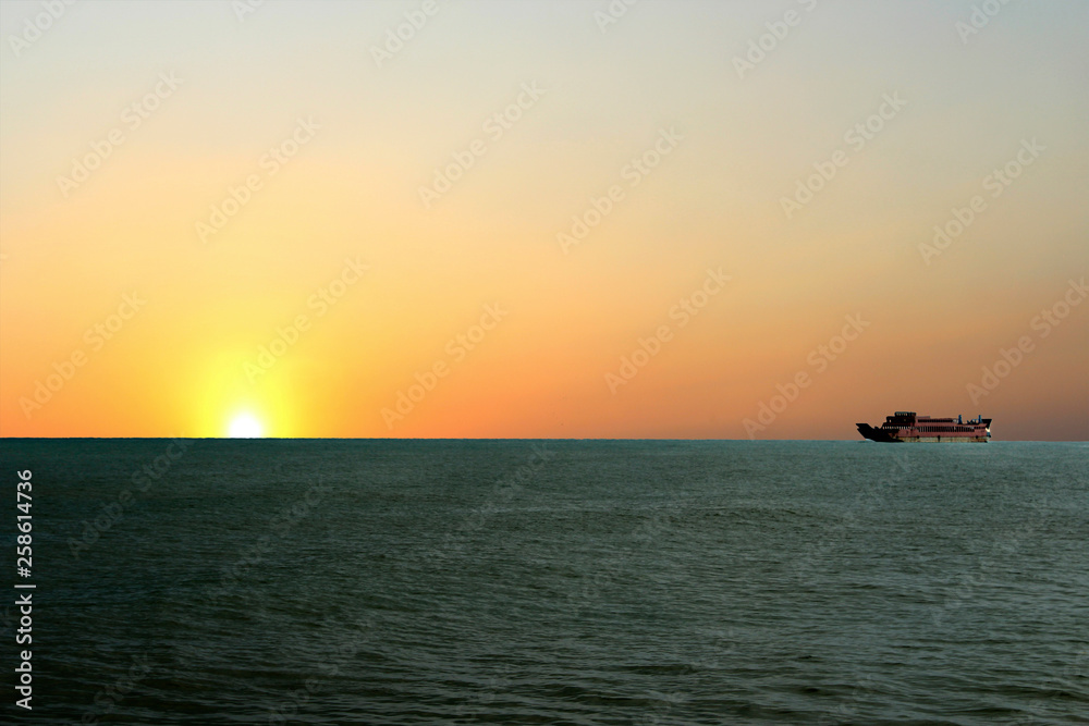 a beautiful sunrise appears on the high seas