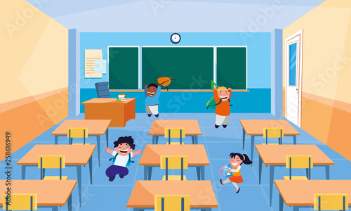 happy little interracial school kids in the classroom
