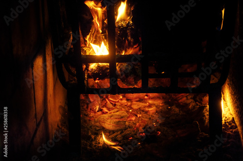 Burning wood in a brazier at night