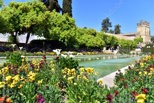 The garden of the Alcazar in Cordoba, a wonderful blend of ponds and flower lined pathways, Cordoba, Spain © akturer