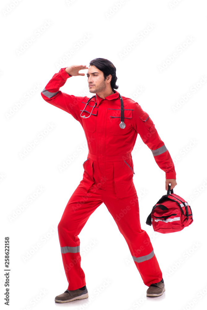 Young paramedic in red uniform isolated on white Young paramedic in red uniform isolated on white