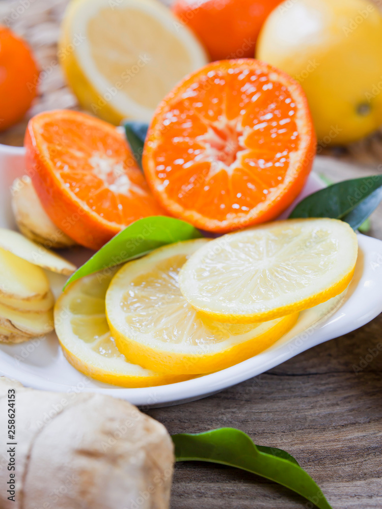 Citrus - Lemon, lime, mandarine and ginger fresh slices for a delicious drink.