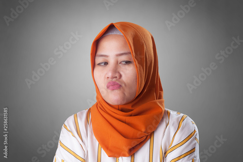 Cynical Muslim Woman Looking to the Side photo